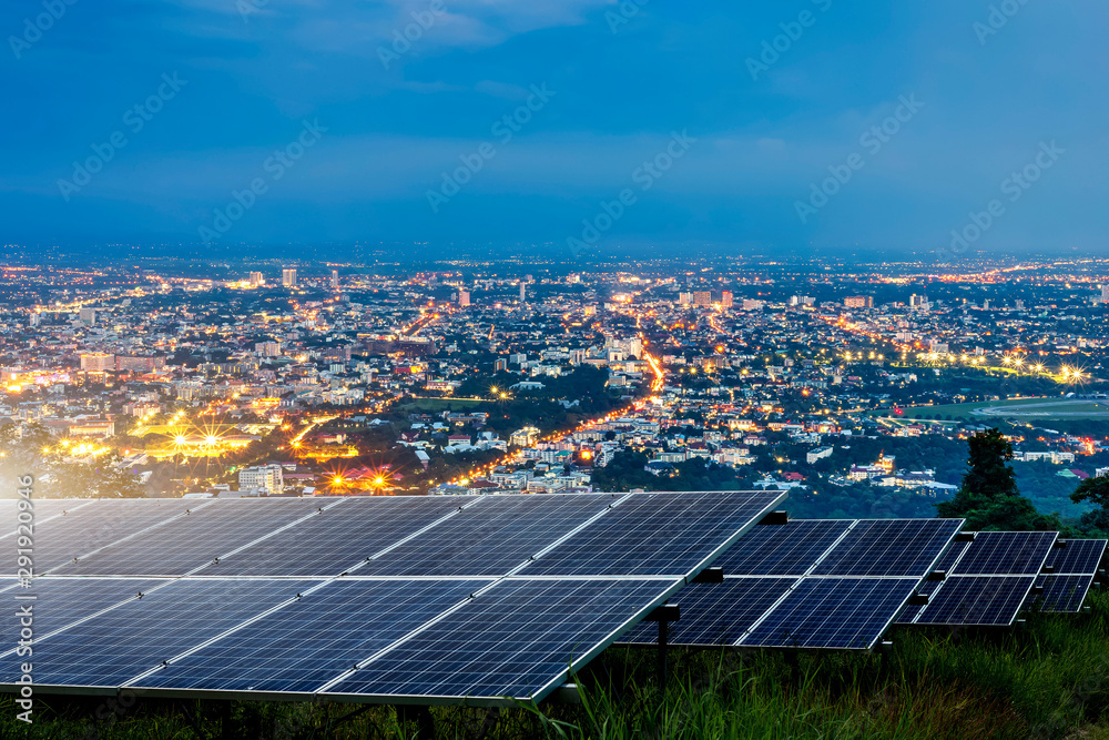 solar-panel-with-city-night-architecture-electric-energy-light-backgroundclean-alternative-power-energy-concept-stockpack-adobe-stock Solar panels with a city at night illuminated in the background.